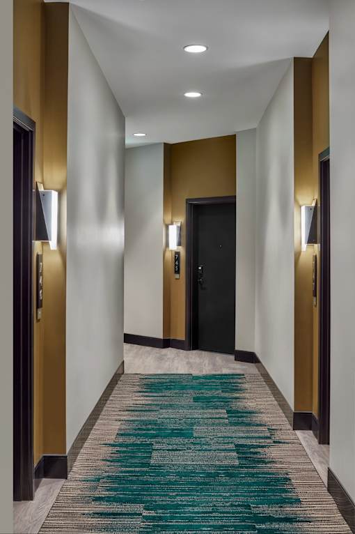 Unit Entry with bright lighting and wide hallways