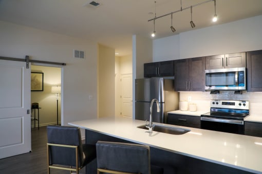 Expansive Kitchen  Countertops at The Met at Metro Centre Apartments, Owings Mills