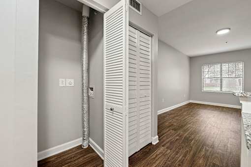 A room with a white door and a window. at Crogman School Lofts, Atlanta GA