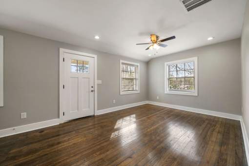 Living room with ceiling fan and light at Balfour Marietta Apartments, Marietta, GA