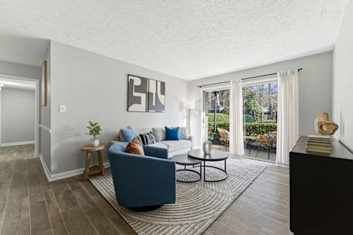 Living room with attached balcony at The Reserve at Brookhaven, Atlanta, GA, 30329