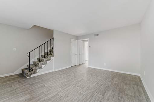 Room with door and staircase at Broadway at East Atlanta, Atlanta, Georgia