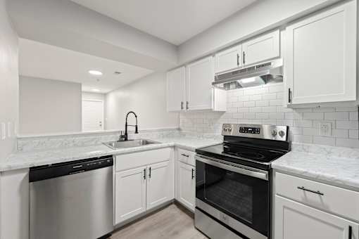 Kitchen with white and black appliances