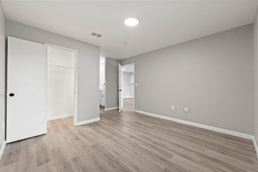 Unfurnished Wooden flooring rooms with ceiling light at 2000 Oasis Apartments, Atlanta, 30316