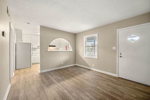 Living room with Bedroom with New Modern Flooring Throughout at Balfour 296, Lilburn, GA