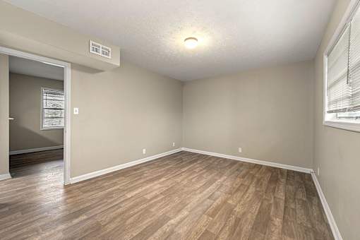 Bedroom with New Modern Flooring Throughout at Balfour 296, Lilburn, GA 30047