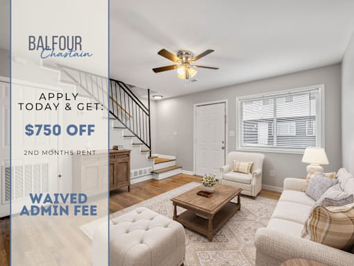 A living room with a staircase and a ceiling fan, advertising a $750 off 2nd months rent deal.