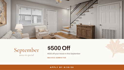 A room with a staircase and a couch with a September move-in special offer at Balfour Chastain, Sandy Springs, GA
