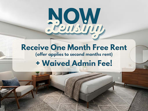 A room with a bed, chair, and table is advertised for leasing with a free first month and waived admin fee.