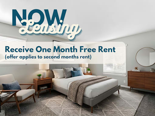 A bedroom with a bed, chair, and nightstand is advertised for leasing with a one month free rent offer.