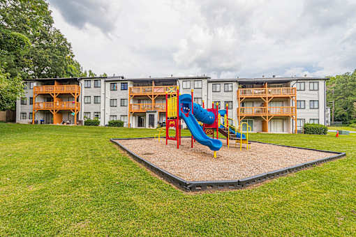 Playground with blue slide at Pinewood Townhomes, Tucker, GA