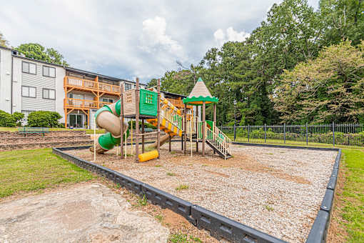 Playground with green slide at Pinewood Townhomes, Tucker