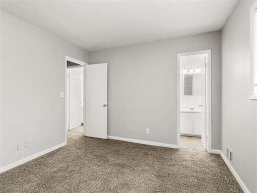 Bedroom with white bath at Pinewood Townhomes, Tucker, 30084