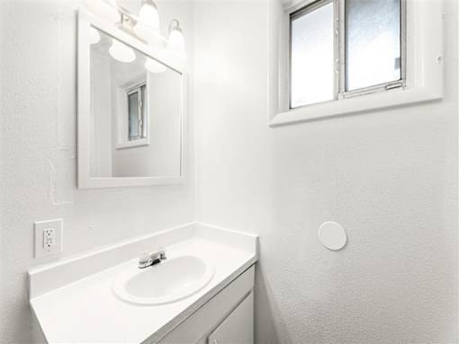 White sink in bathroom at Pinewood Townhomes, Tucker