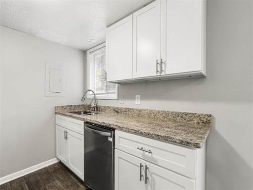 White cabinets and sink in kitchen at Pinewood Townhomes, Tucker, GA, 30084