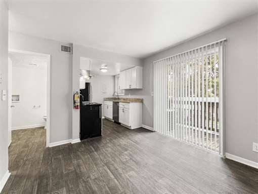 Kitchen with wooden floor at Pinewood Townhomes, Tucker, Georgia