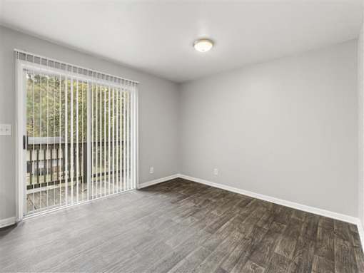 Living room with wooden floor at Pinewood Townhomes, Tucker, GA, 30084