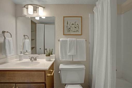 Bathroom with mirror at Lacota Apartments, Atlanta, Georgia