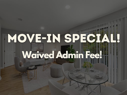A dining room with a glass table and chairs, and a sign that reads "MOVE-IN SPECIAL! Waived Admin Fee!"