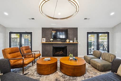 A modern living room with a fireplace and a television.