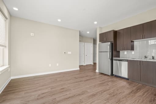 a kitchen and living room in a 555 waverly unit