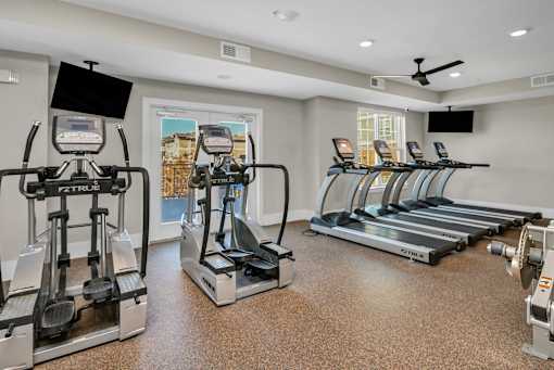 A gym with treadmills and elliptical machines.at Residence at Marina Bay, Irmo, SC 29063