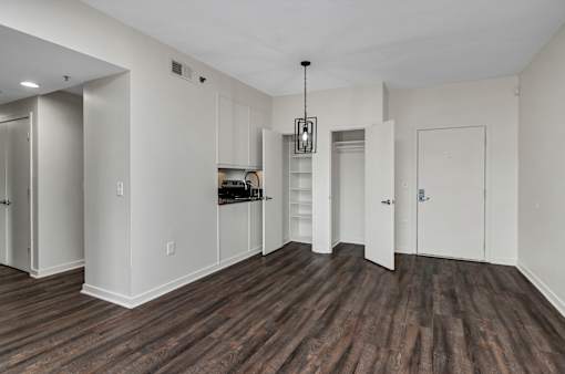 A room with white walls and wooden flooring.