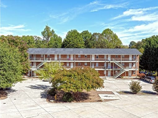 an image of a building with trees in front of it