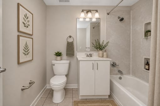 A white toilet and cabinet in a bathroom.