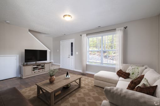 a living room with a couch and a coffee table