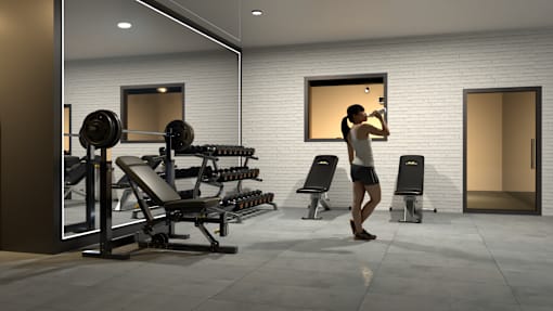 A woman is working out in a gym with a variety of equipment.