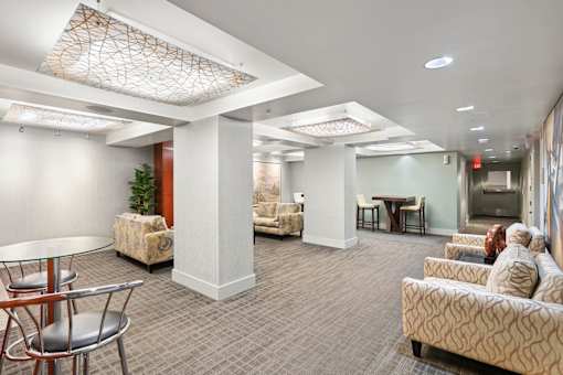 a large room with couches and chairs and a table