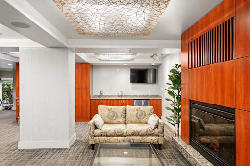 a living room with a couch and a fireplace