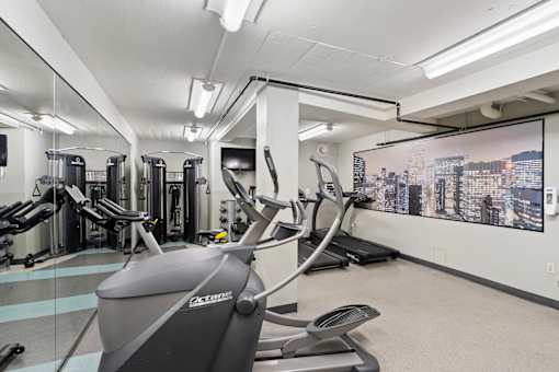 the gym is equipped with treadmills and other exercise equipment