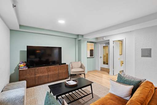 a living room with a couch and a tv
