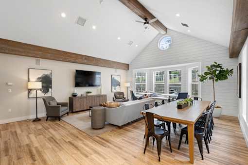 a living room with a dining room table and a couch at Oriel Apartments, Portland, 97225