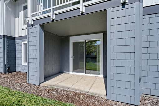 a covered patio with a sliding glass door at Summer Creek Apartments, Tigard, 97223