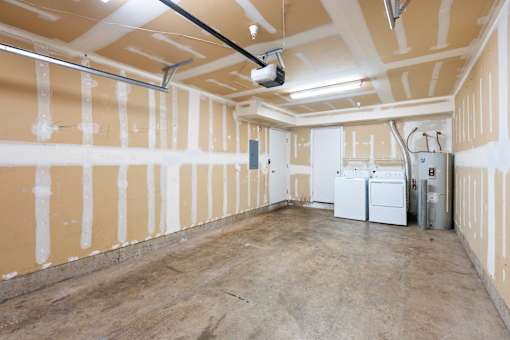 a large room with white walls and appliances in it at Summer Creek Apartments, Tigard, OR, 97223