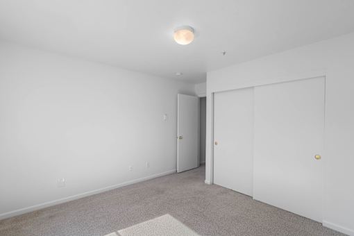 Bedroom With Closet at Summer Creek Apartments, Tigard, OR, 97223