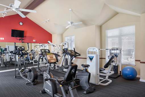 a gym with cardio equipment at Summer Creek Apartments, Tigard, OR