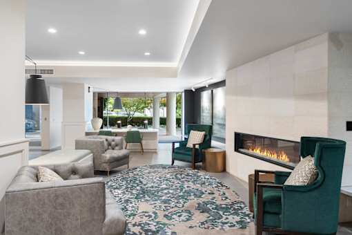 a living room filled with furniture and a fireplace