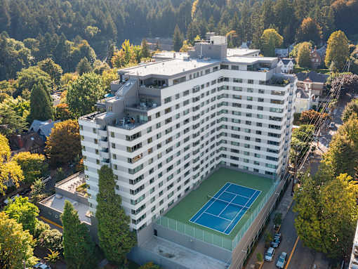 a building with a tennis court on the bottom of it