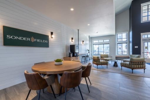 a dining room with a wooden table and chairs at Sonder Fields in Happy Valley, OR