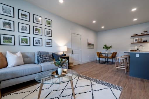 a living room with a couch and a table at Sonder Fields in Happy Valley, OR