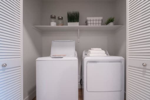 a white washer and dryer in a laundry room at Sonder Fields in Happy Valley, OR