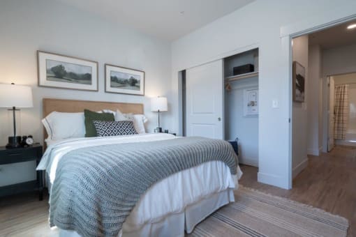 a bedroom with a bed and a closet at Sonder Fields in Happy Valley, OR