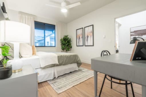 a bedroom with a bed and a desk and a window at Sonder Fields in Happy Valley, OR