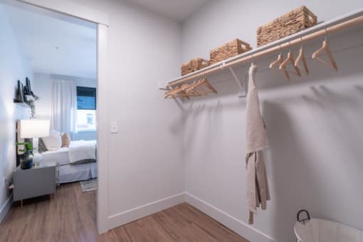 a bathroom with a closet and a mirror in a living room at Sonder Fields in Happy Valley, OR