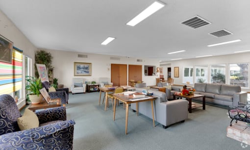 a living room with couches and chairs and a table