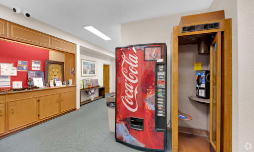 a coca cola vending machine in a lobby